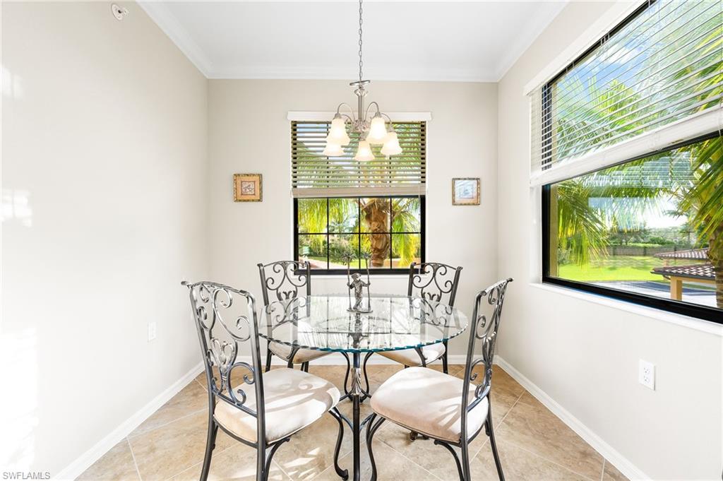 9727 Acqua Court, Unit 421 Naples, FL 34113 - Photo 12 of 35 a view of a dining room with furniture window and outside view