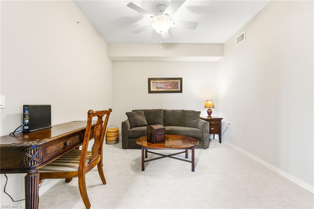 9727 Acqua Court, Unit 421 Naples, FL 34113 - Photo 22 of 35 a view of a livingroom with workspace and a couch