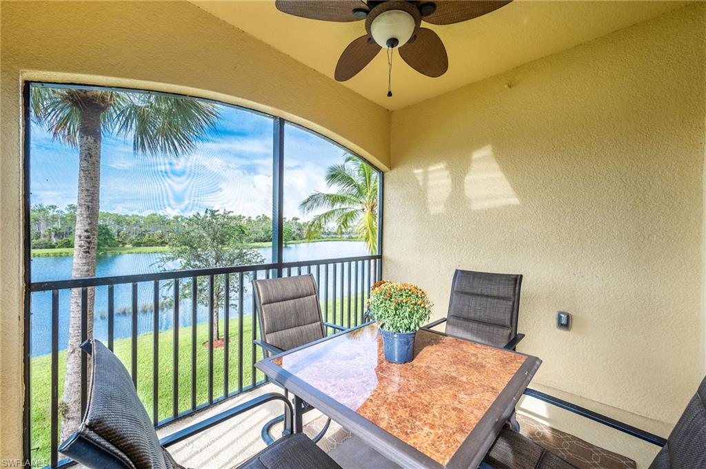 9727 Acqua Court, Unit 421 Naples, FL 34113 - Photo 25 of 35 a view of a dining room with furniture window and wooden floor