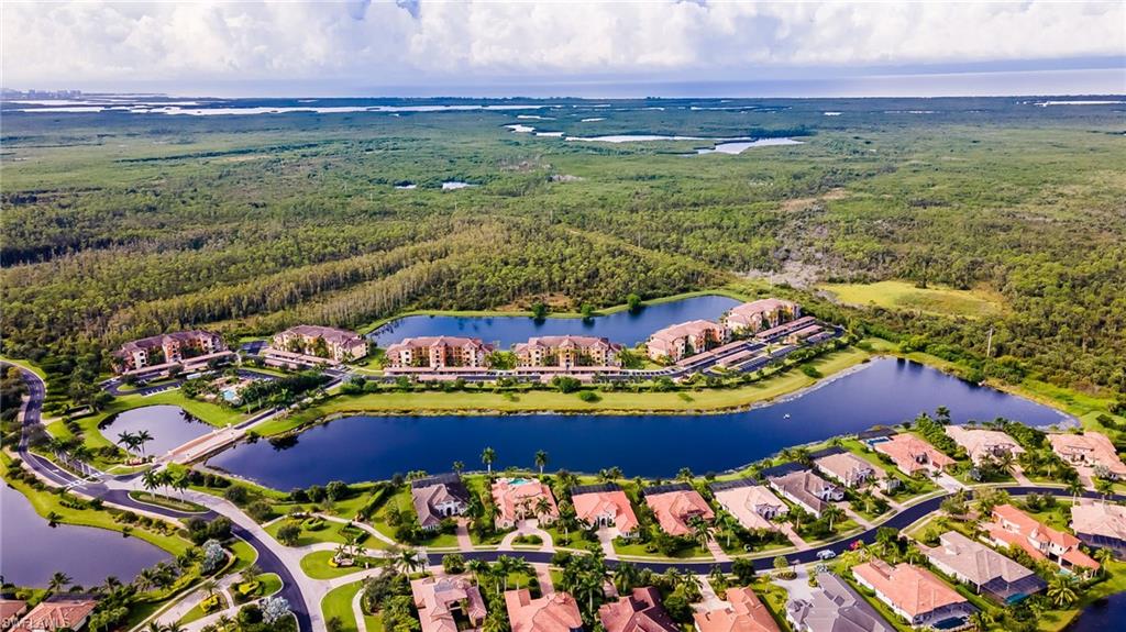 9727 Acqua Court, Unit 421 Naples, FL 34113 - Photo 28 of 35 a view of an outdoor space yard patio and swimming pool