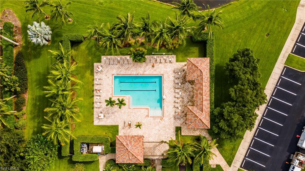9727 Acqua Court, Unit 421 Naples, FL 34113 - Photo 30 of 35 an aerial view of a residential houses with yard