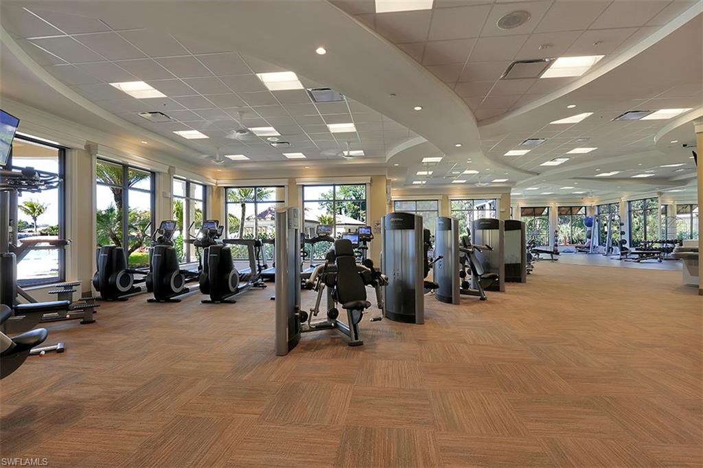 9727 Acqua Court, Unit 421 Naples, FL 34113 - Photo 33 of 35 a view of a room with gym equipment
