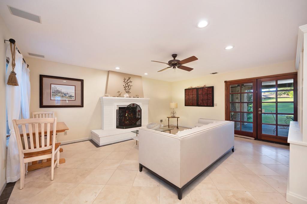 14965 Anillo Way Rancho Murieta, CA 95683 - Photo 20 of 59 a living room with furniture a ceiling fan a rug and a window