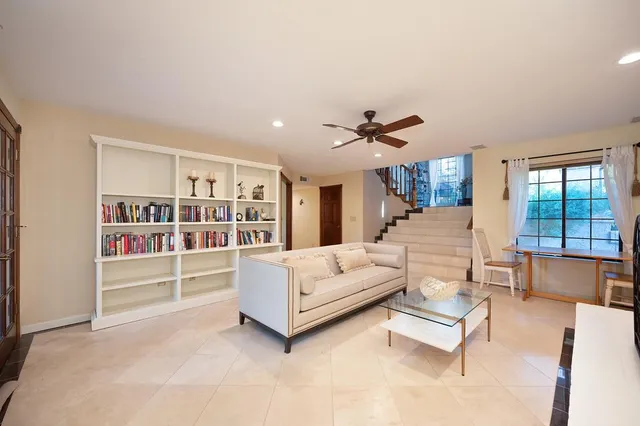 a spacious bedroom with a bed and furniture