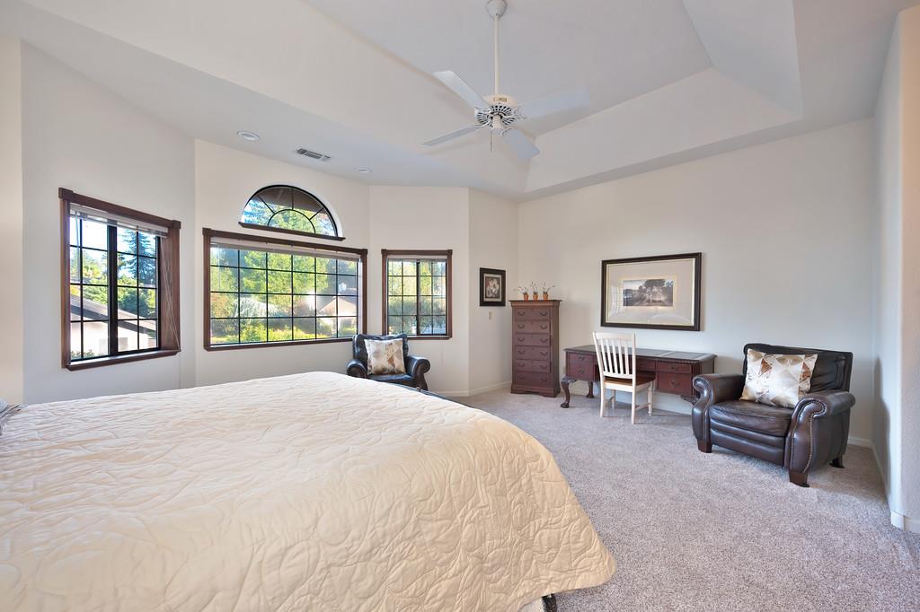 14965 Anillo Way Rancho Murieta, CA 95683 - Photo 24 of 59 a spacious bedroom with a large bed and a window