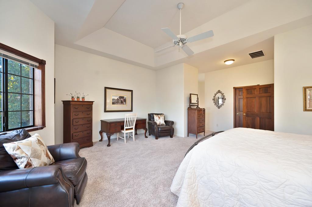 14965 Anillo Way Rancho Murieta, CA 95683 - Photo 25 of 59 a spacious bedroom with a bed and furniture