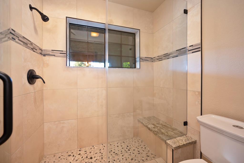 14965 Anillo Way Rancho Murieta, CA 95683 - Photo 34 of 59 a bathroom with a shower and a toilet