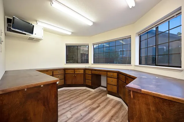 a view of a garden with a building in the background