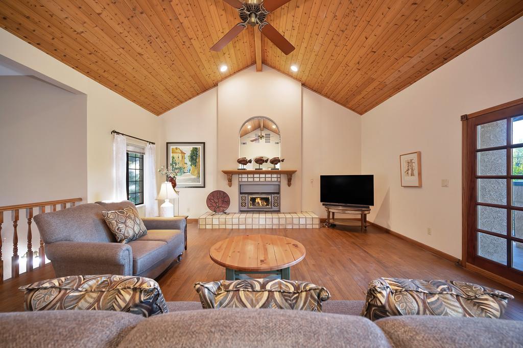 14965 Anillo Way Rancho Murieta, CA 95683 - Photo 5 of 59 a living room with furniture a rug and a flat screen tv