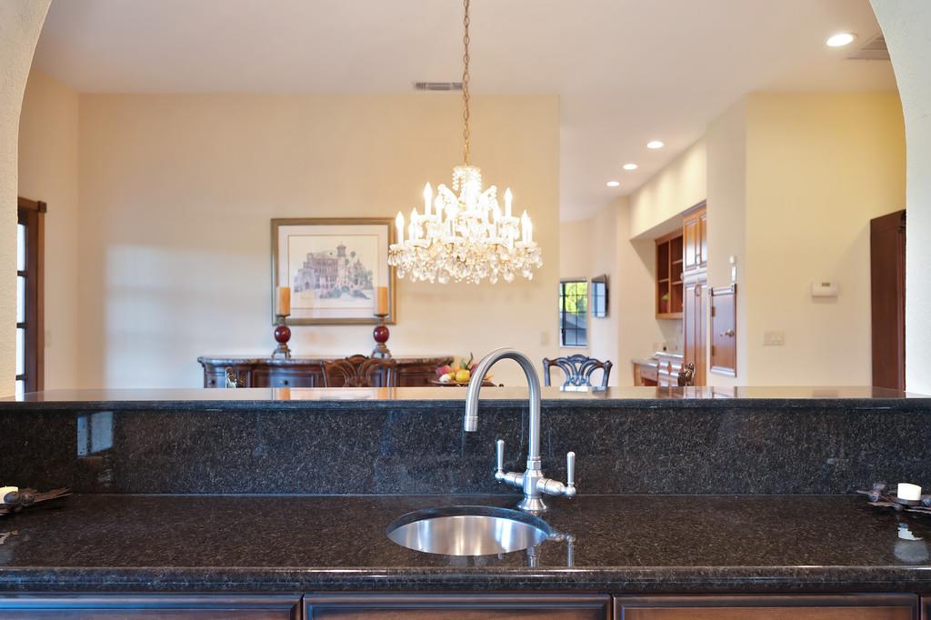 14965 Anillo Way Rancho Murieta, CA 95683 - Photo 7 of 59 a kitchen with a sink and chandelier