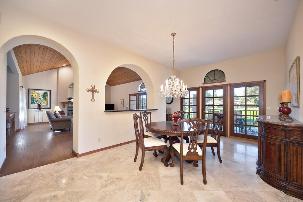 14965 Anillo Way Rancho Murieta, CA 95683 - Photo 8 of 59 a view of a dining room with furniture and a chandelier
