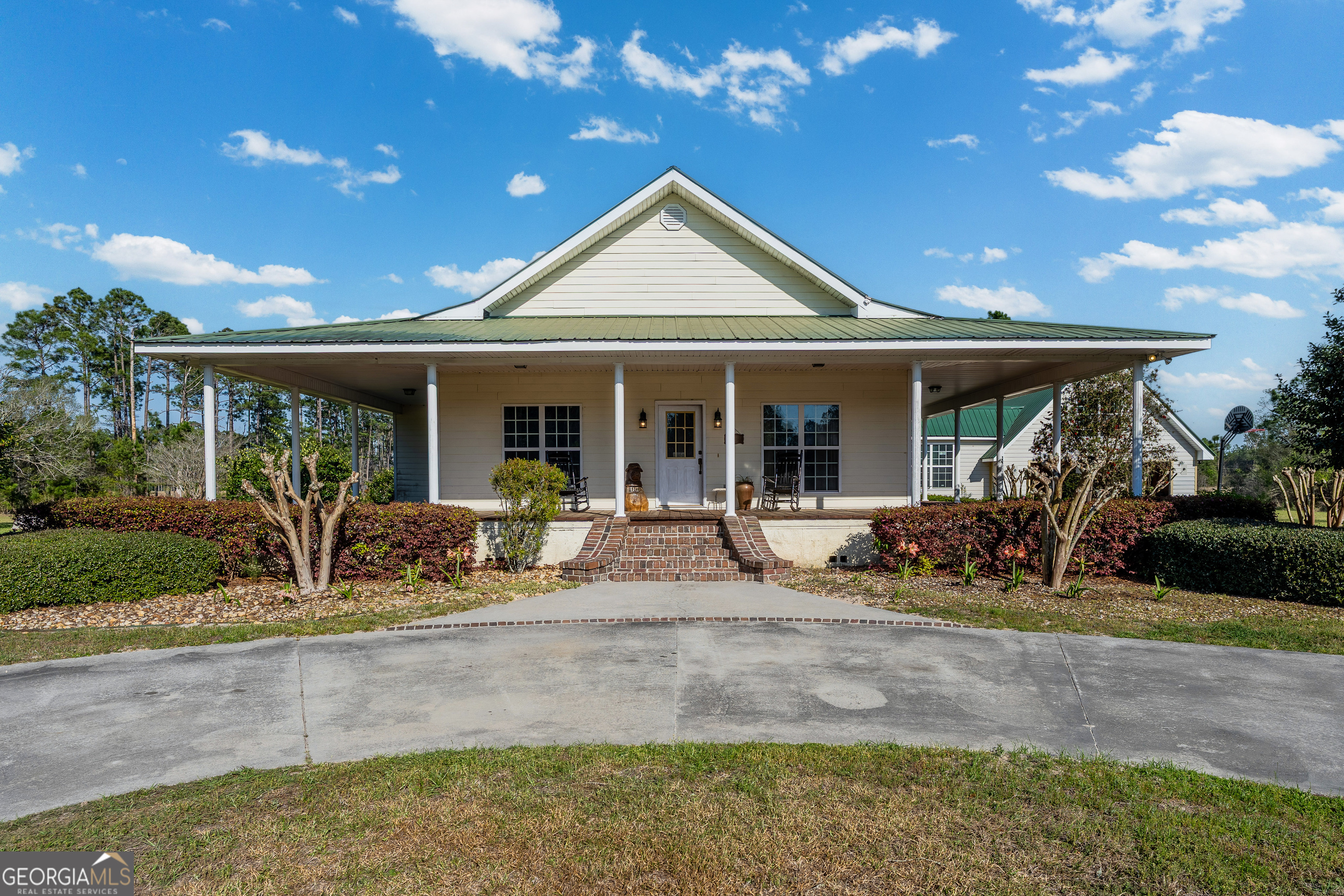 3300 Connor Lane Waycross, GA 31503 - Photo 1 of 42 a front view of a house with garden