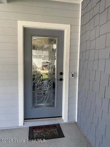 a view of a house with a yard porch and sitting area