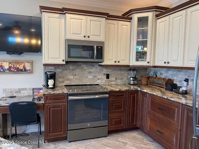 a kitchen with kitchen island granite countertop a sink a counter top space appliances and cabinets