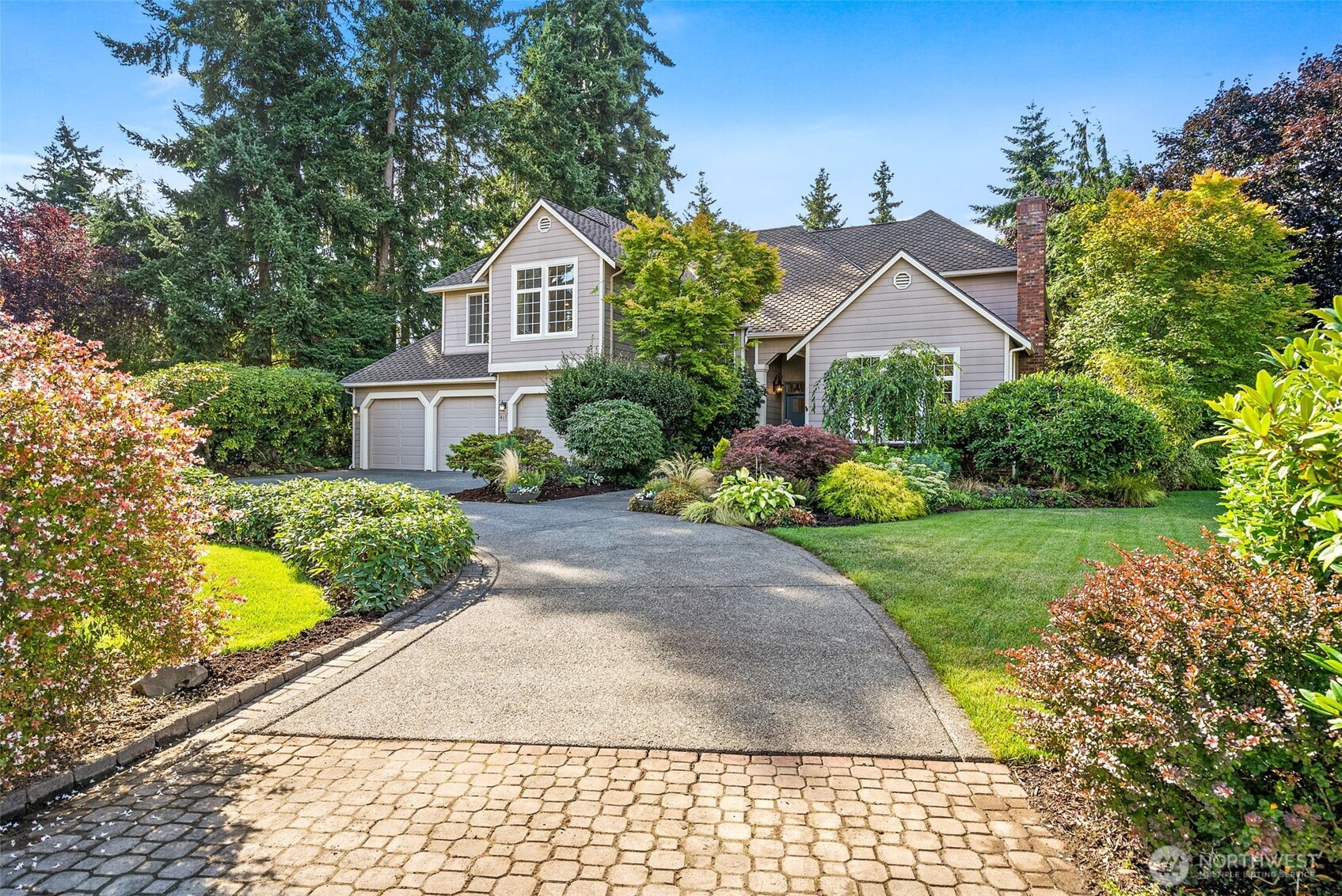 417 Southwest 350th Place Federal Way, WA 98023 - Photo 3 of 39 a front view of a house with a yard and potted plants