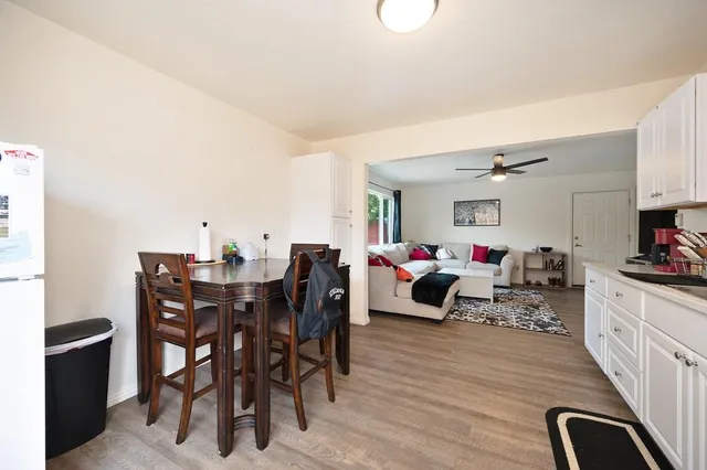 a very nice looking dining room with a table and chairs