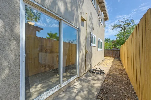 a view of a brick house with a large windows