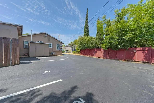 a view of a house with a yard and garage