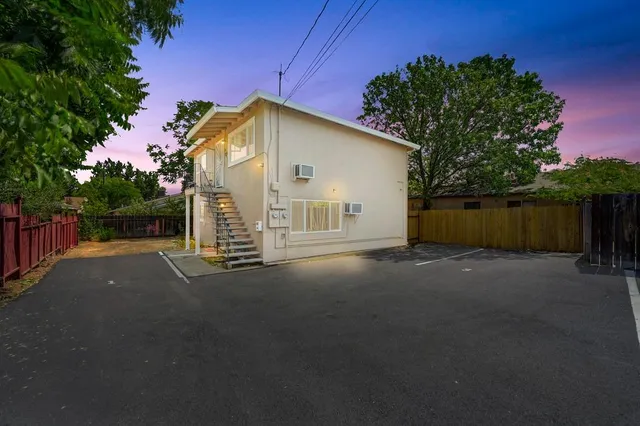 a view of a house with a yard and garage