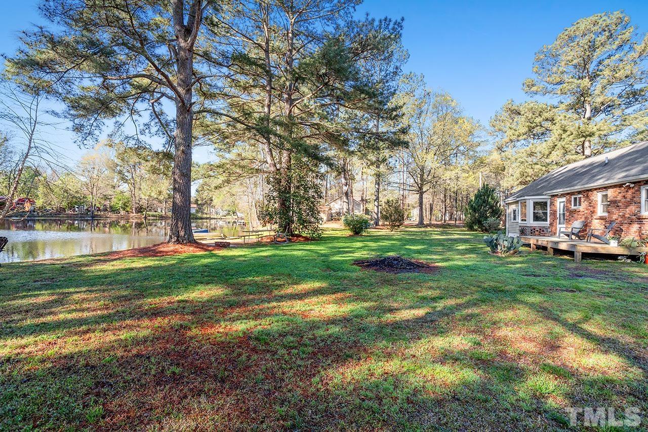 2820 Willow Court Raleigh, NC 27610 - Photo 25 of 33 a view of yard with swimming pool and green space