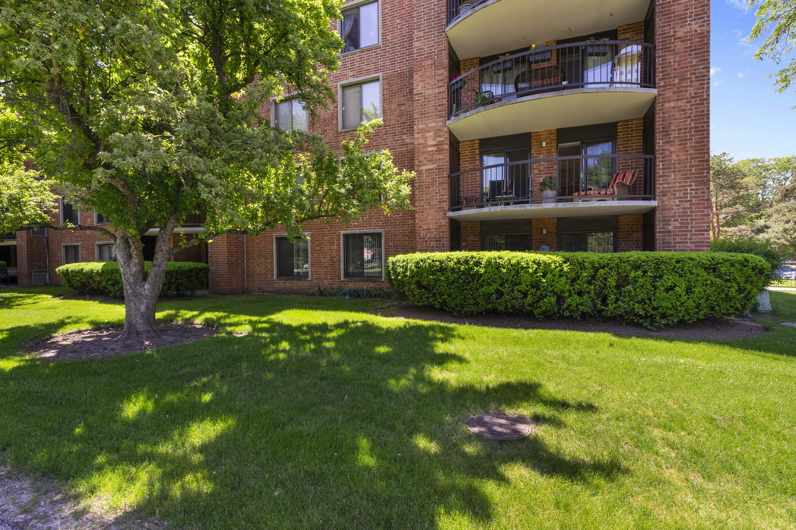 1615 East Central Road, Unit 222C Arlington Heights, IL 60005 - Photo 24 of 30 a front view of a house with a yard