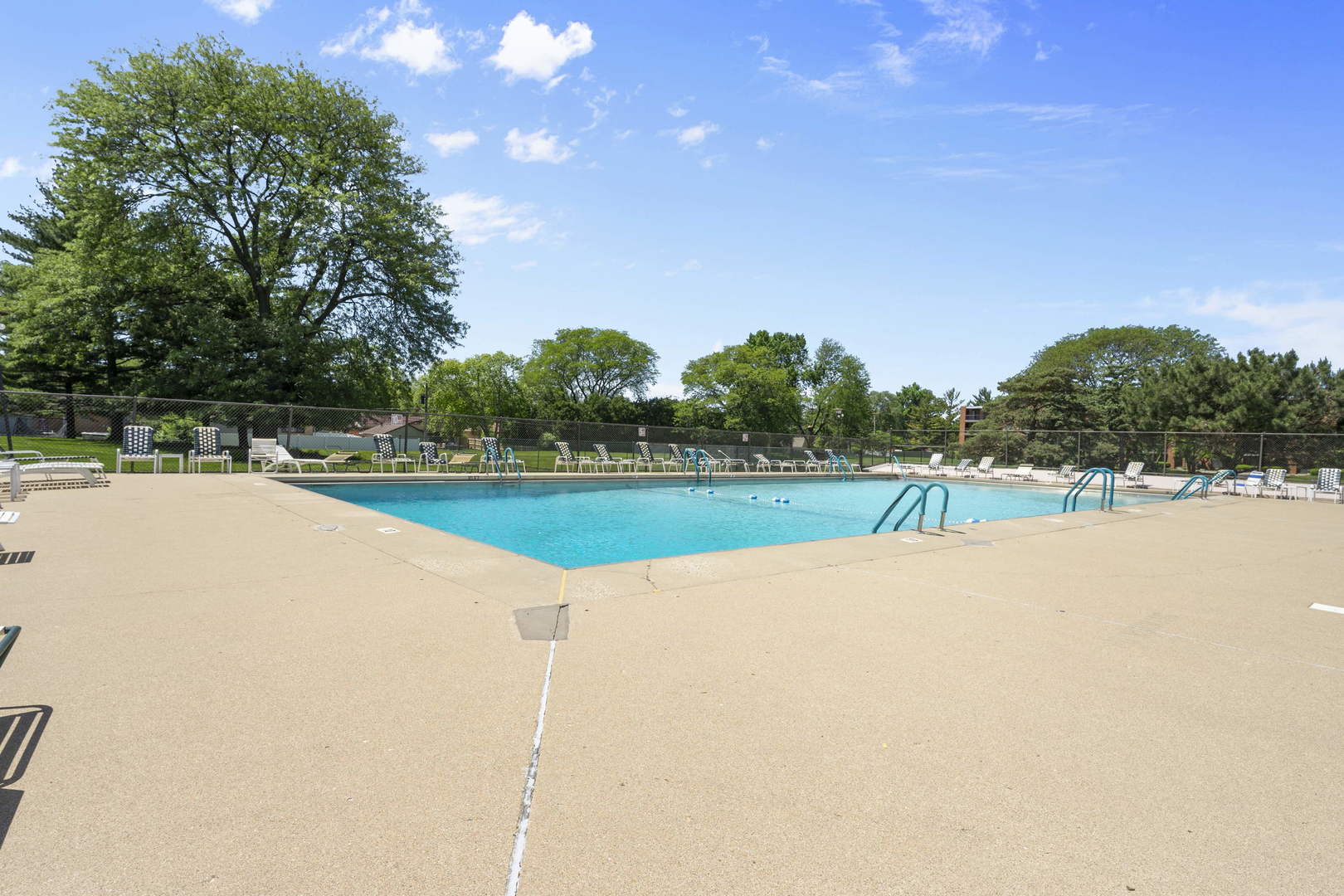1615 East Central Road, Unit 222C Arlington Heights, IL 60005 - Photo 25 of 30 a view of a swimming pool and a yard