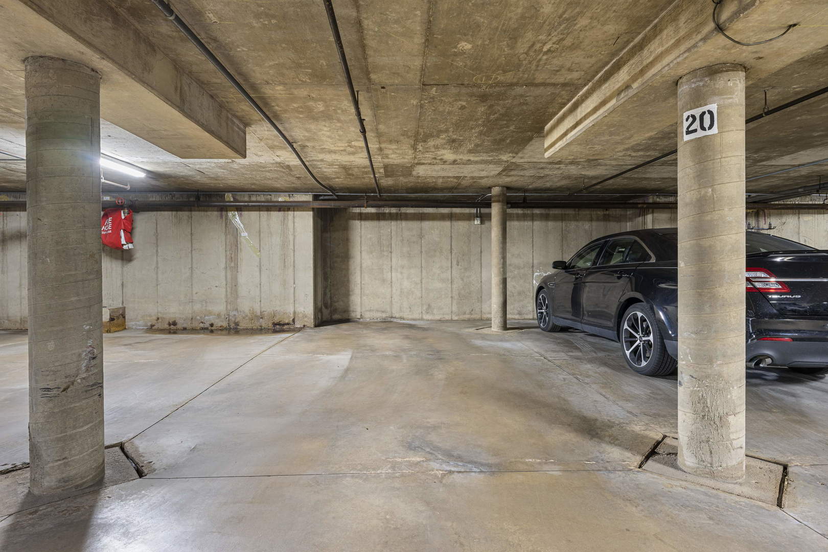 1615 East Central Road, Unit 222C Arlington Heights, IL 60005 - Photo 29 of 30 a view of parking garage with cars