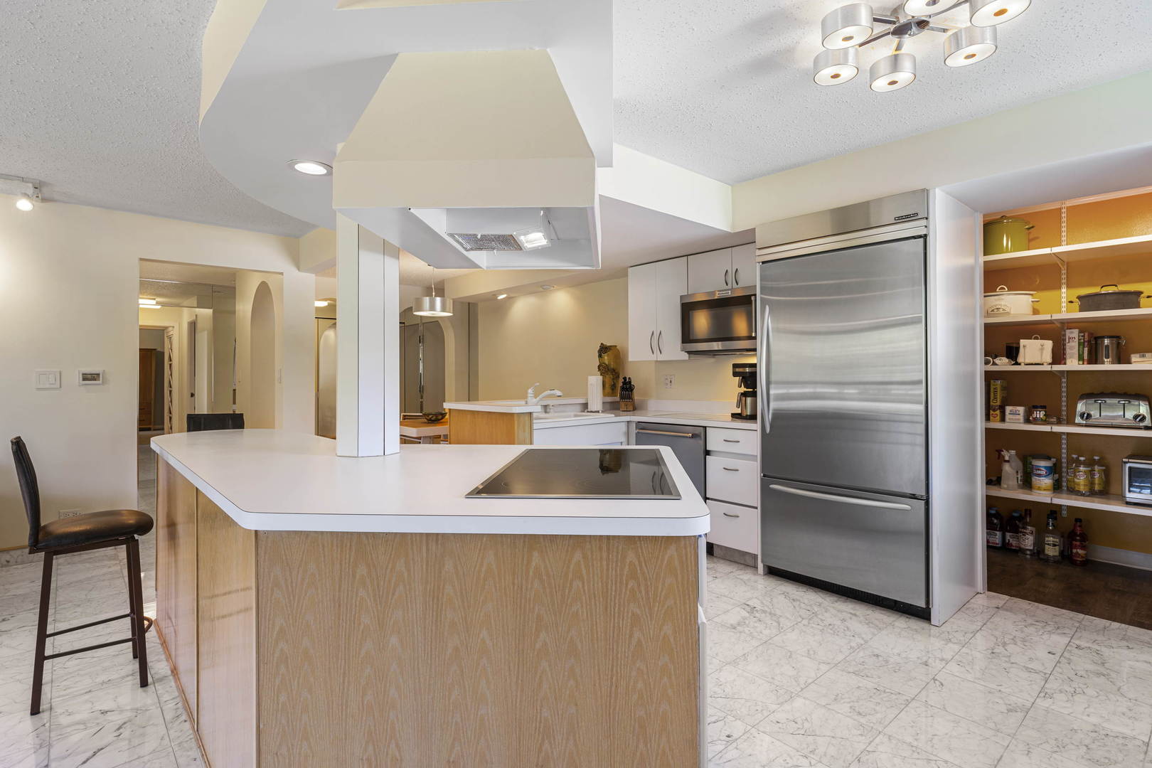 1615 East Central Road, Unit 222C Arlington Heights, IL 60005 - Photo 6 of 30 a kitchen with stainless steel appliances granite countertop a sink stove and refrigerator