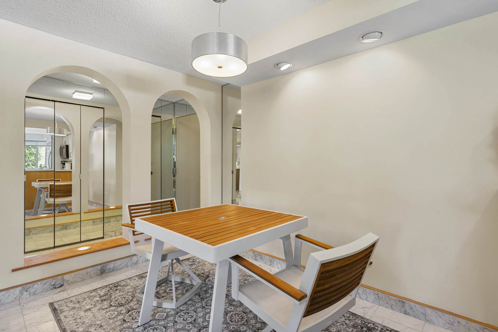 1615 East Central Road, Unit 222C Arlington Heights, IL 60005 - Photo 7 of 30 a view of room with wooden floor and window