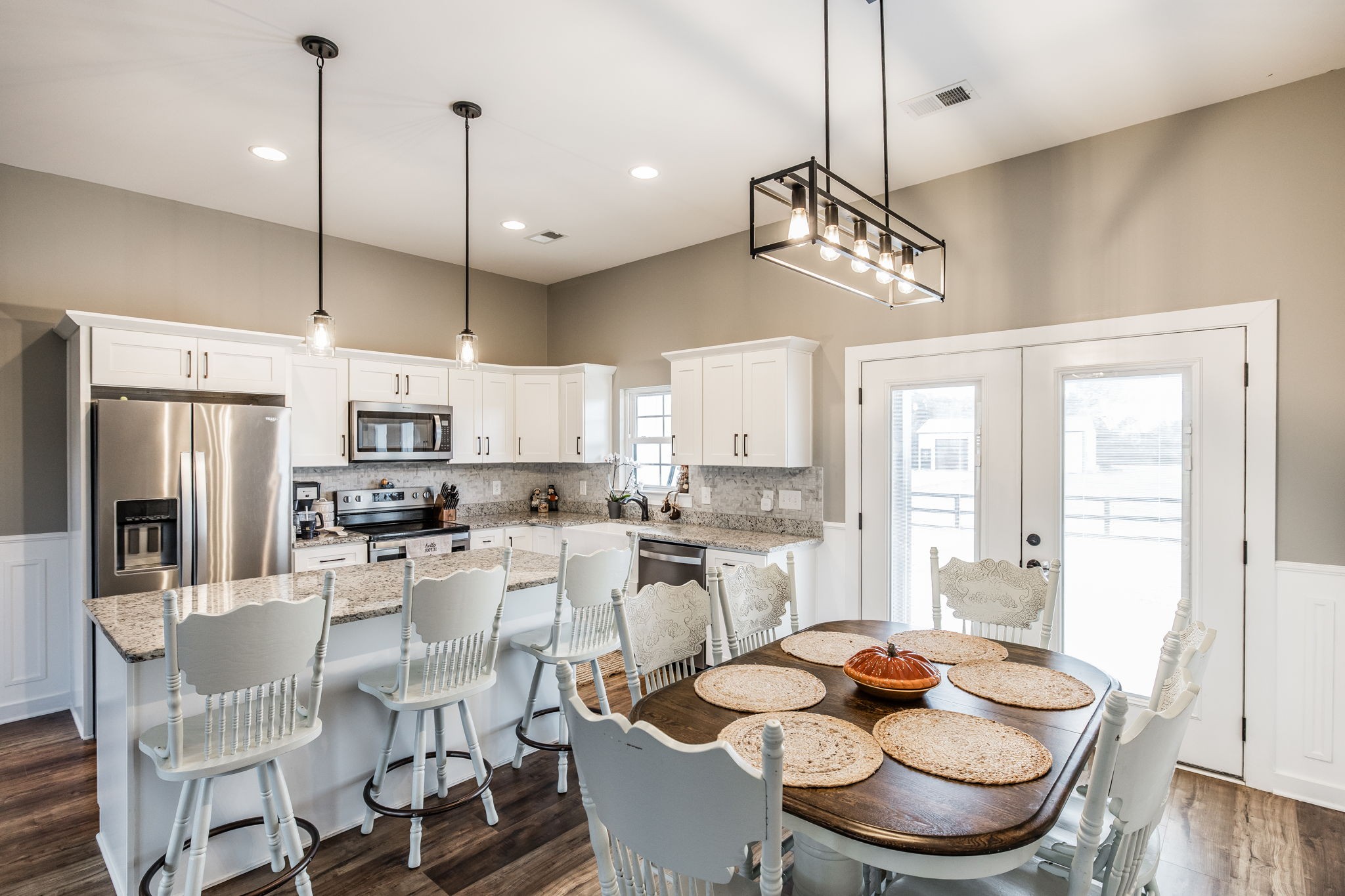 721 New Deal Potts Road Cottontown, TN 37048 - Photo 19 of 73 a dining room with stainless steel appliances kitchen island furniture and a chandelier