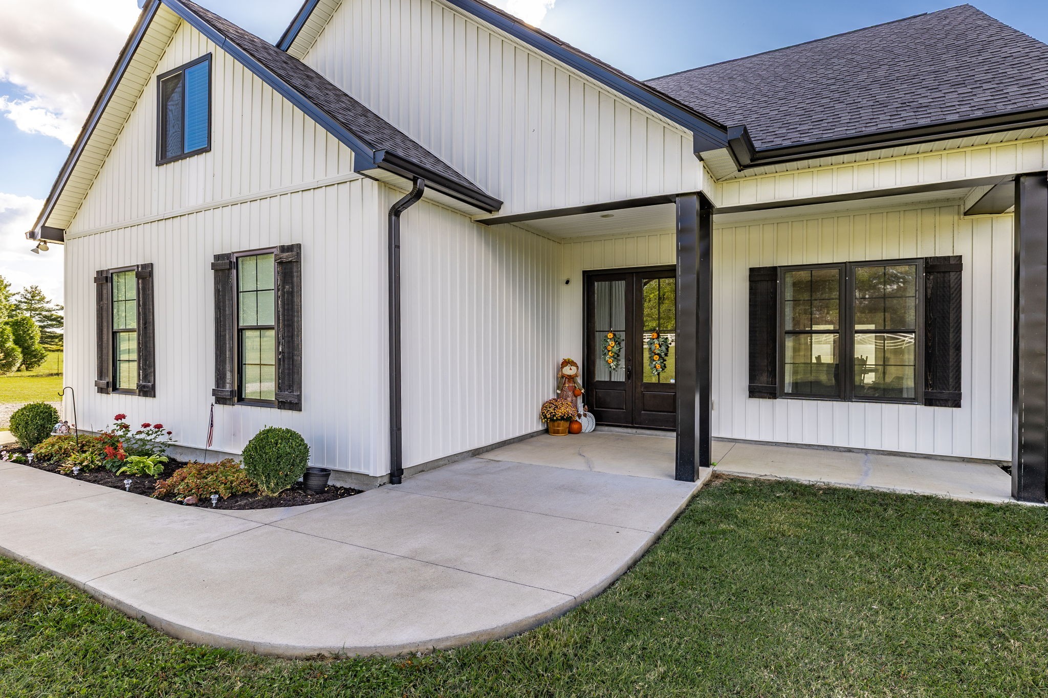 721 New Deal Potts Road Cottontown, TN 37048 - Photo 4 of 73 a view of a house with potted plants and a pathway
