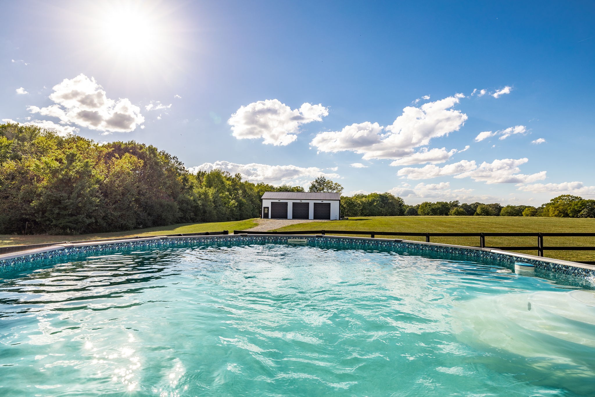 721 New Deal Potts Road Cottontown, TN 37048 - Photo 49 of 73 a view of a swimming pool with an outdoor space and seating area