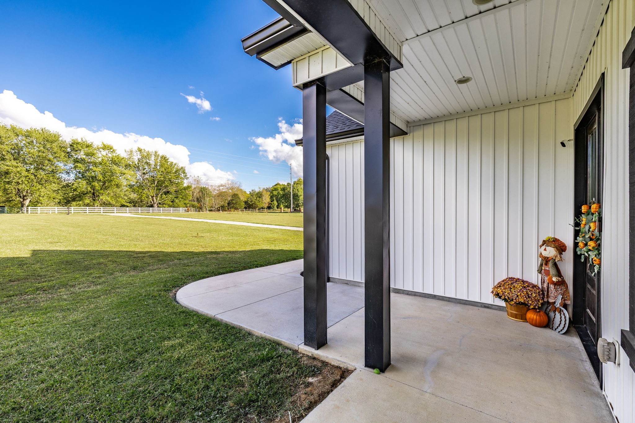 721 New Deal Potts Road Cottontown, TN 37048 - Photo 61 of 73 a view of a room with floor to ceiling windows and yard