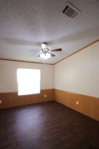 a view of room with hardwood floor and window