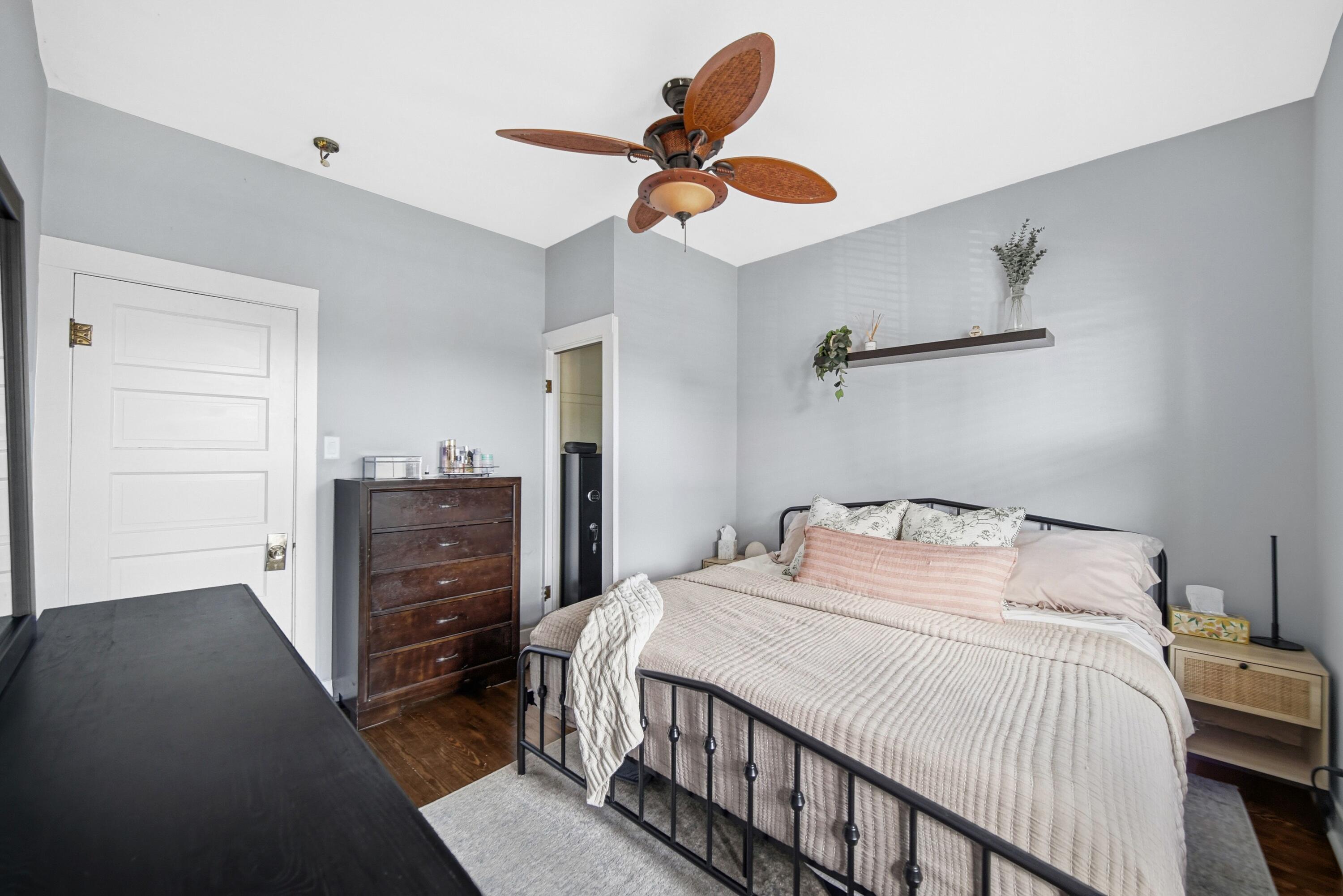 1346 Stanton Avenue Whiting, IN 46394 - Photo 11 of 19 a bedroom with a bed and a ceiling fan