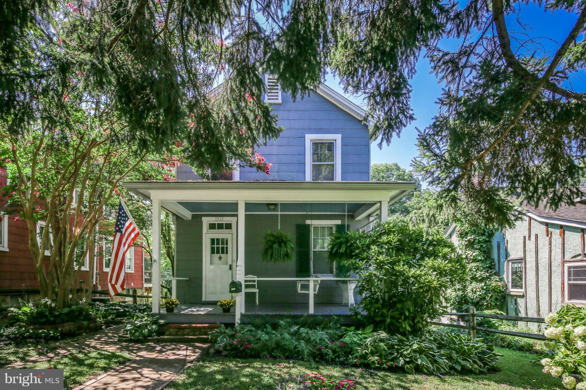 1313 Asbury Road Baltimore, MD 21209 - Photo 1 of 30 a front view of a house with garden