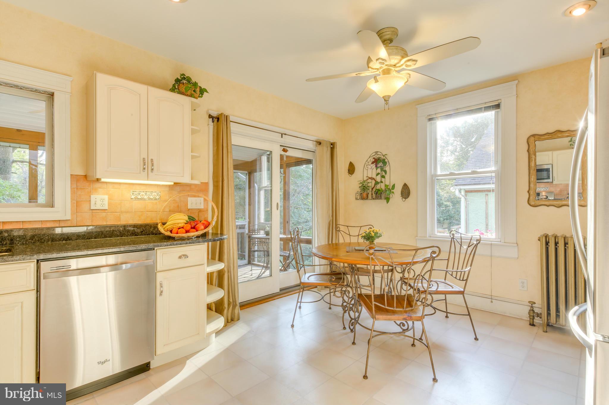 1313 Asbury Road Baltimore, MD 21209 - Photo 11 of 30 a dining room with furniture and window