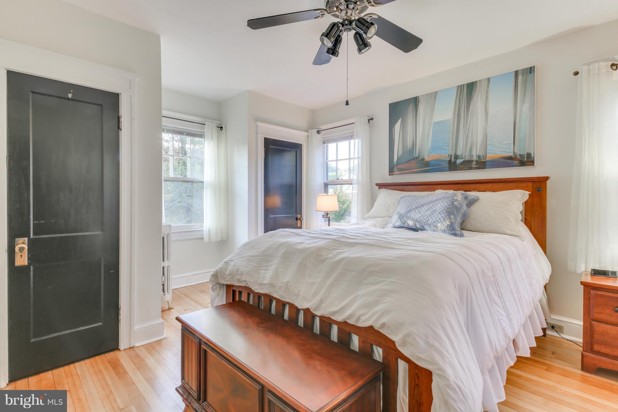 1313 Asbury Road Baltimore, MD 21209 - Photo 14 of 30 a bedroom with a bed and a chandelier