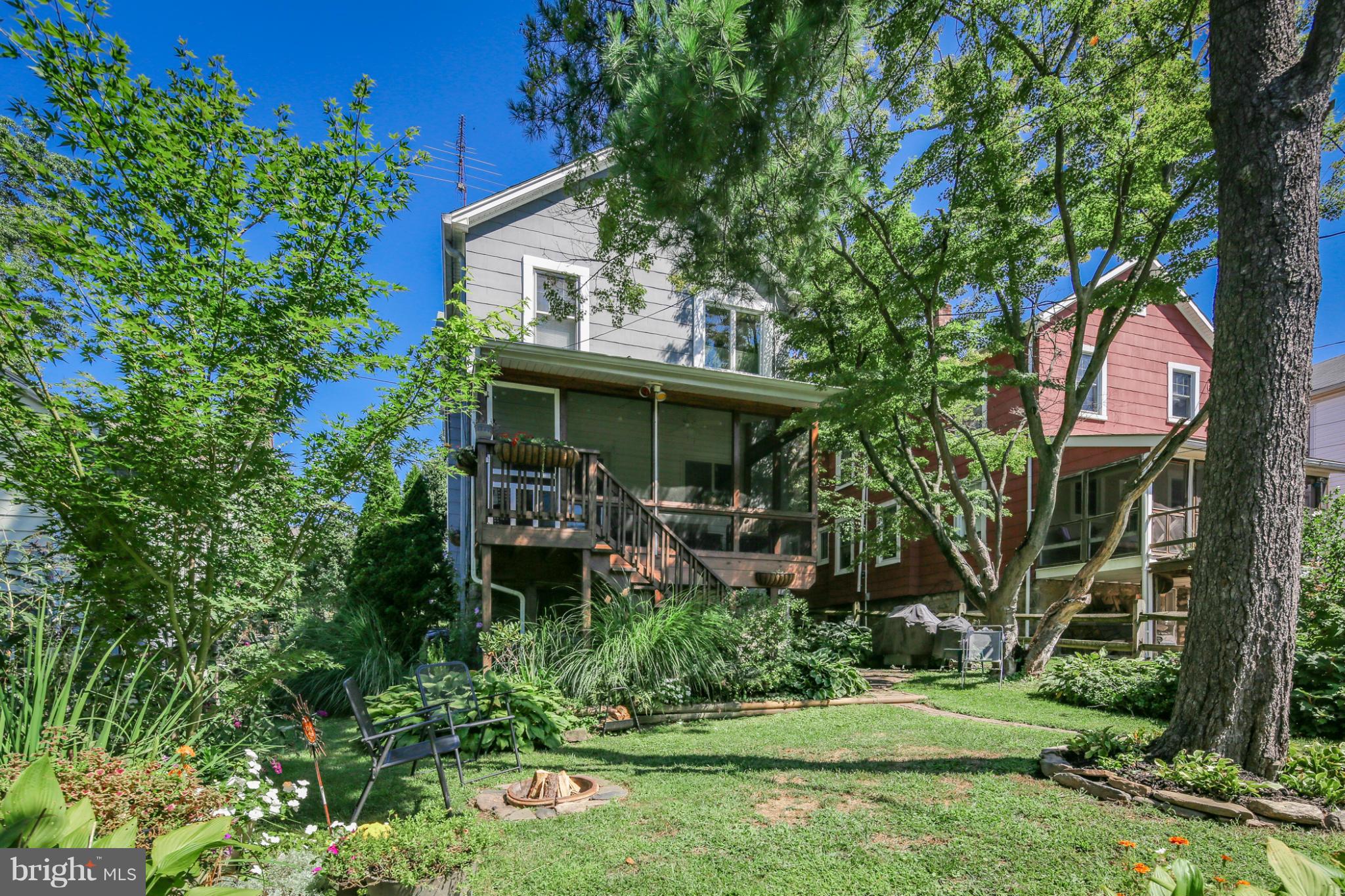 1313 Asbury Road Baltimore, MD 21209 - Photo 27 of 30 a view of house with a yard and potted plants