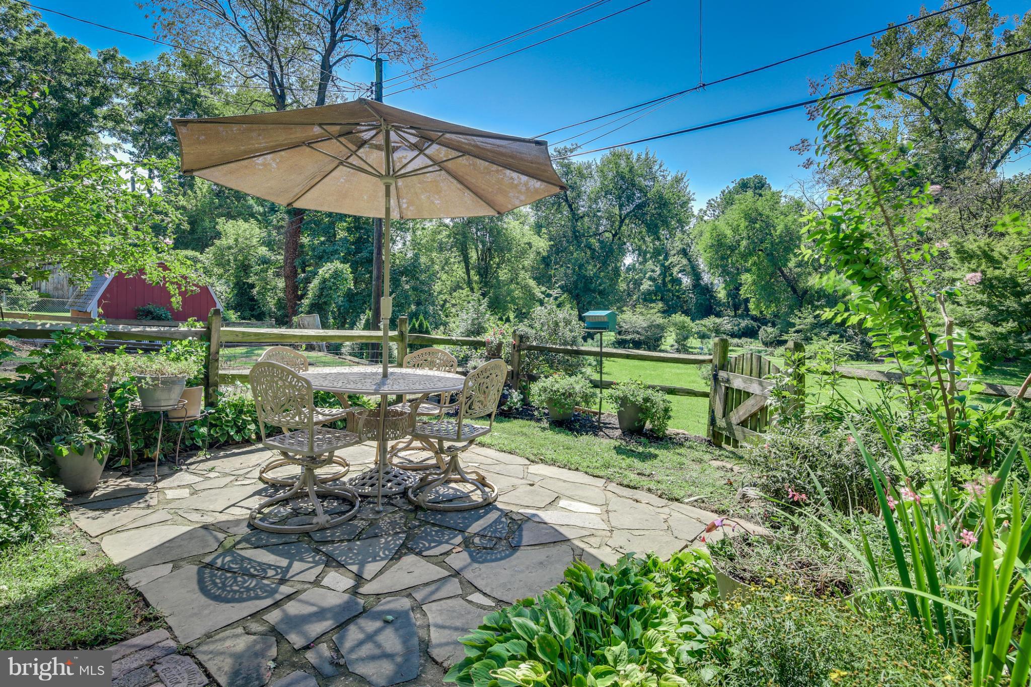 1313 Asbury Road Baltimore, MD 21209 - Photo 29 of 30 a view of a chair and table in the garden