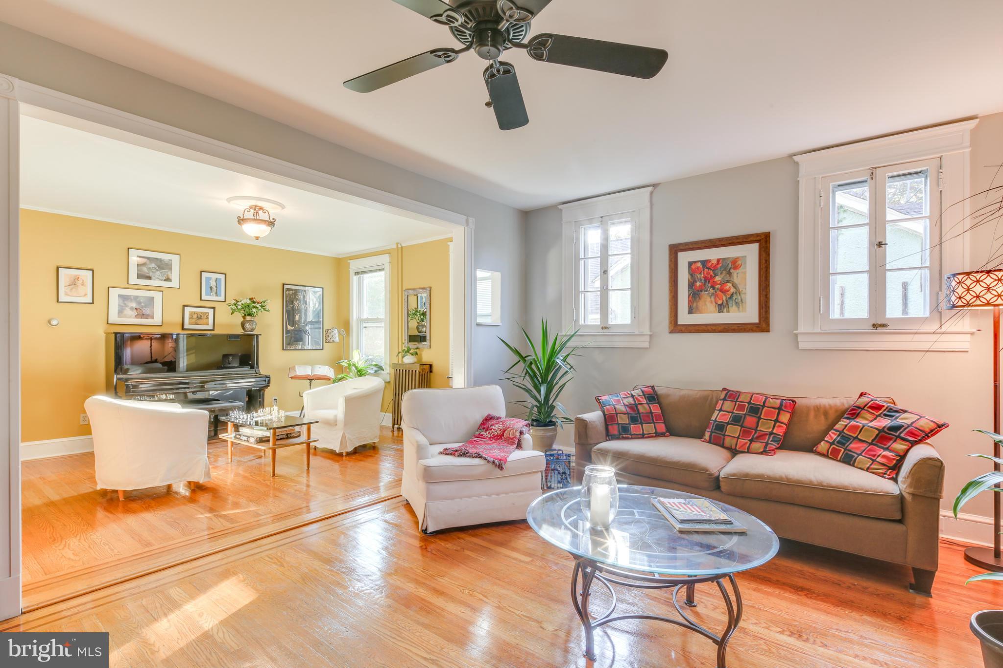 1313 Asbury Road Baltimore, MD 21209 - Photo 5 of 30 a living room with furniture and a large window