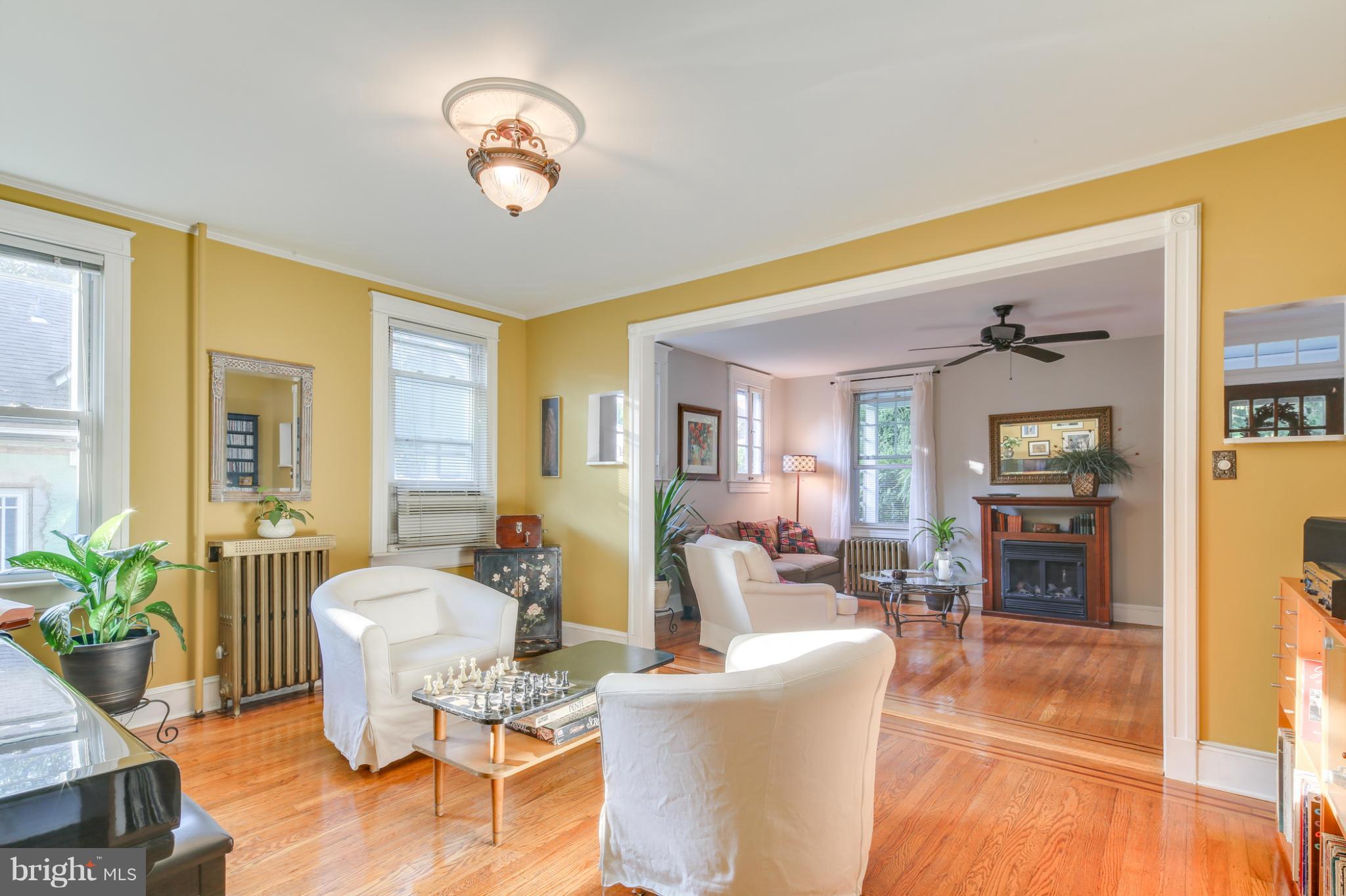 1313 Asbury Road Baltimore, MD 21209 - Photo 6 of 30 a living room with furniture and a chandelier