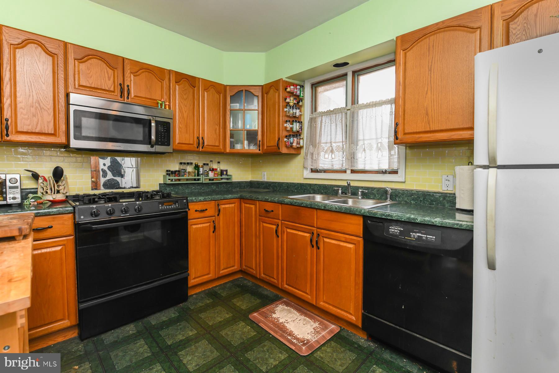 111 Atkins Avenue Hamilton, NJ 08610 - Photo 4 of 11 a kitchen with stainless steel appliances granite countertop a stove a sink dishwasher and a refrigerator