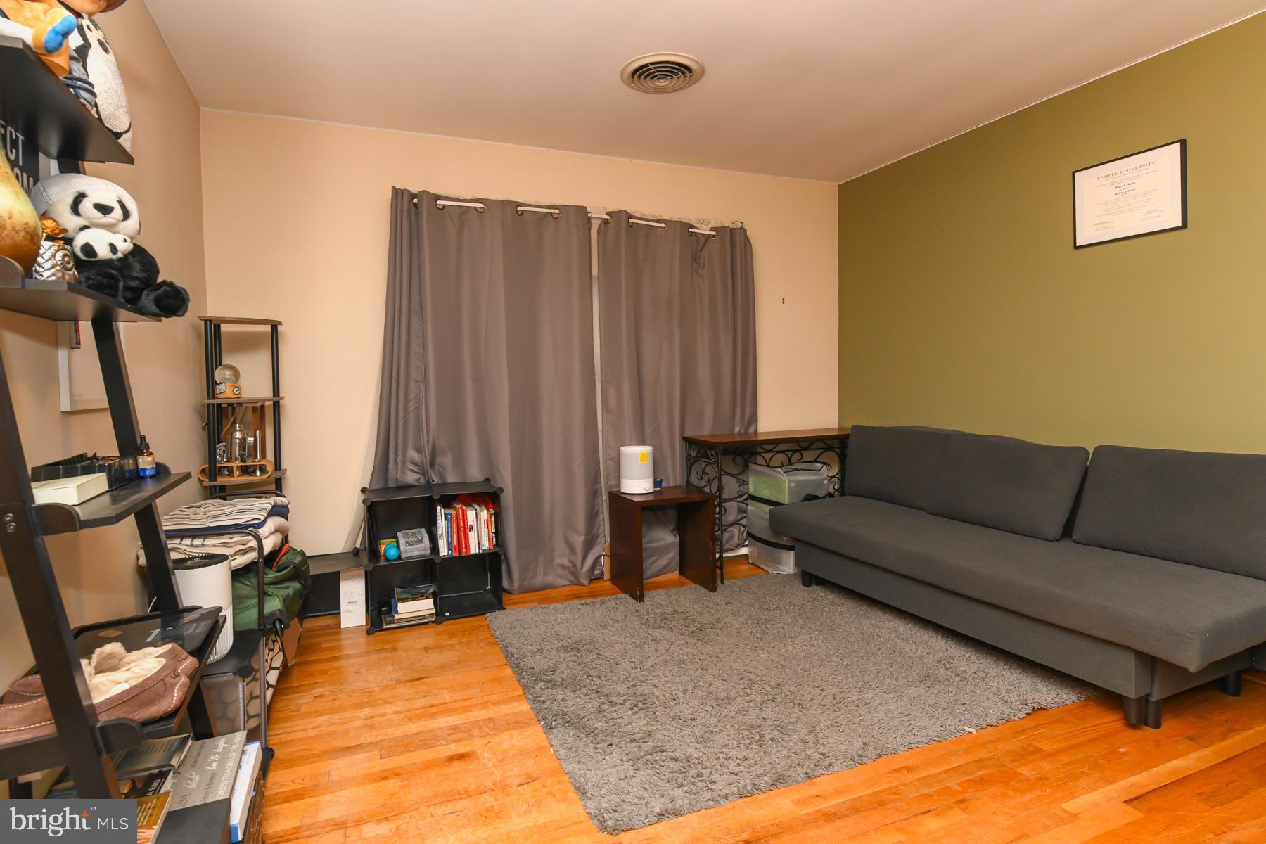 111 Atkins Avenue Hamilton, NJ 08610 - Photo 7 of 11 a living room with furniture a piano and a flat screen tv