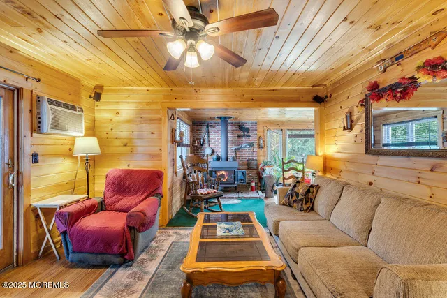 a living room with furniture a couch and a chandelier