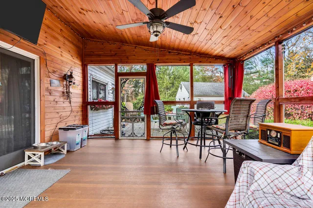 a dining room with furniture water view and a fireplace