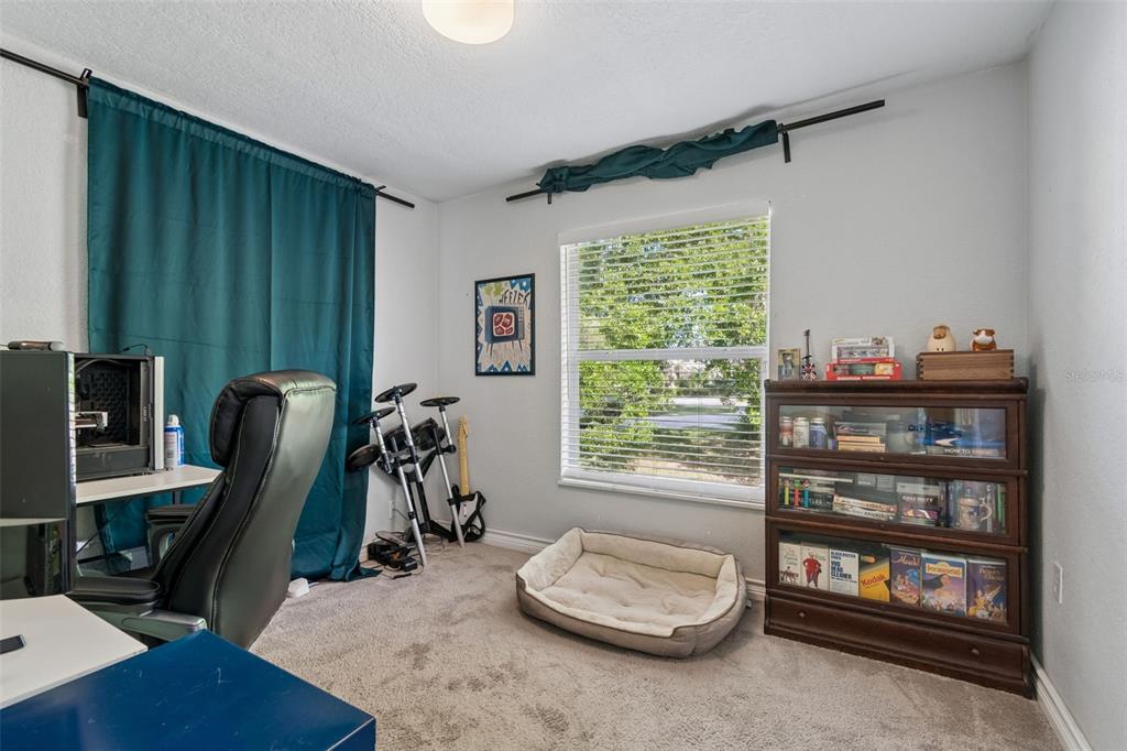 2301 West Eldred Drive Tampa, FL 33603 - Photo 18 of 34 a room with furniture and a window