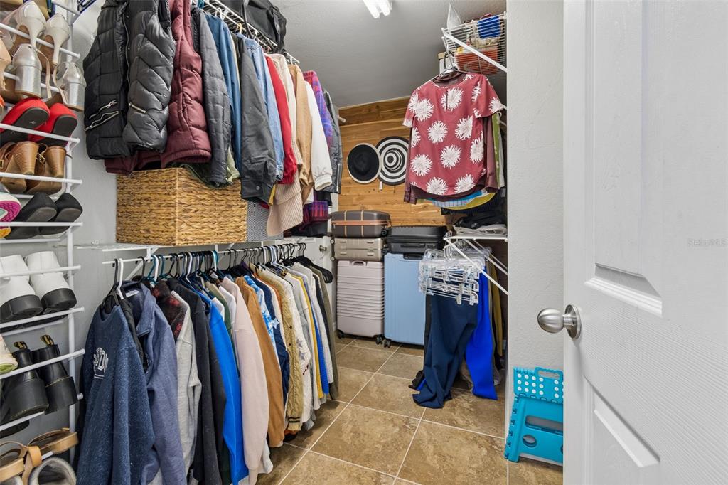 2301 West Eldred Drive Tampa, FL 33603 - Photo 22 of 34 a view of walk in closet with clothes and shoes