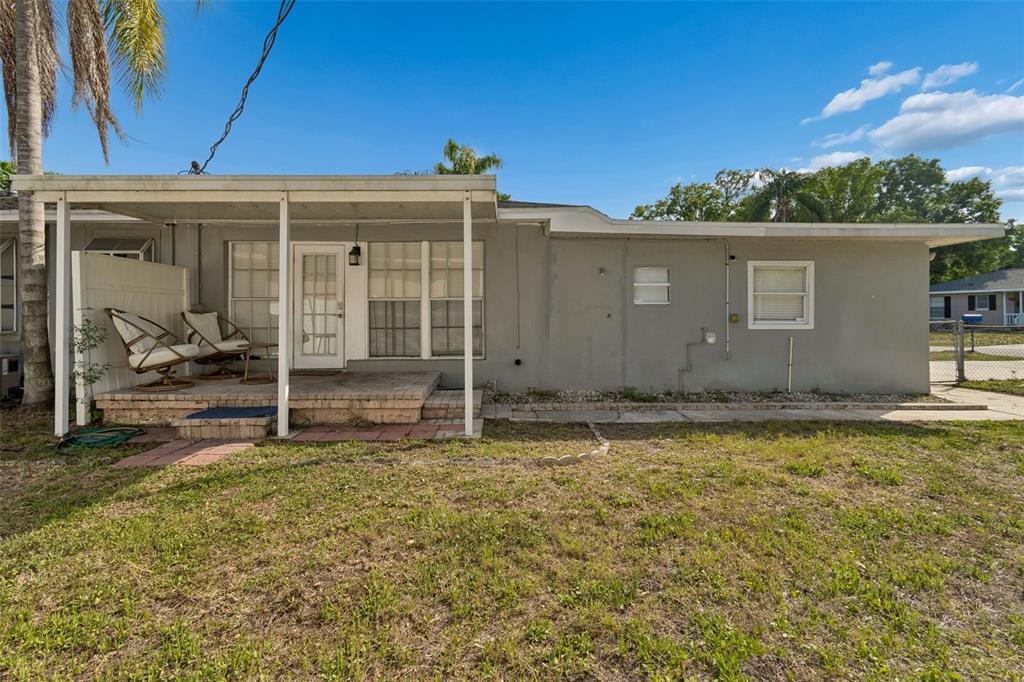 2301 West Eldred Drive Tampa, FL 33603 - Photo 27 of 34 a view of a house with backyard and sitting area