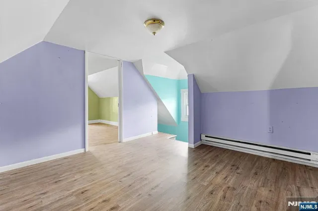 a view of a livingroom with wooden floor